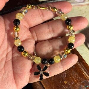 Chic Black and Gold Beaded Bracelet with Floral Charm